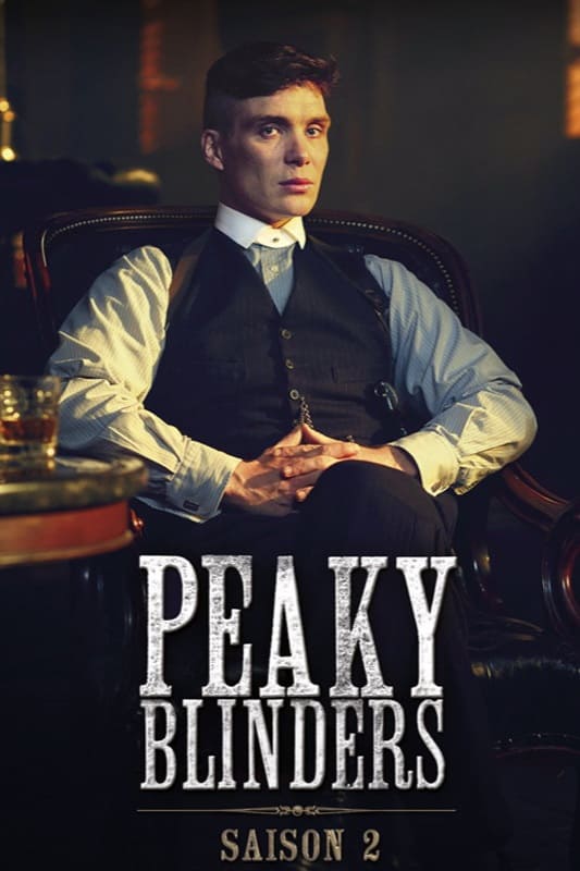 A man in a suit sits in a leather chair with hands folded. The text Peaky Blinders and Saison 2 is displayed at the bottom, suggesting this gripping series is available on Nordic IPTV. The setting appears dimly lit and serious.