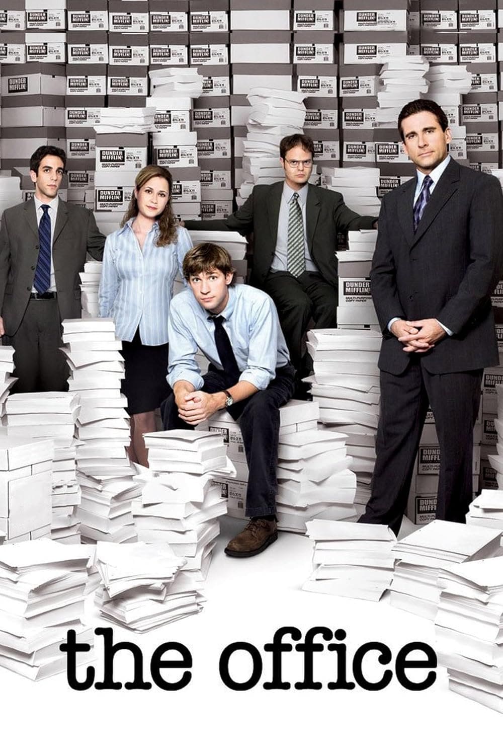 Five office workers stand or sit among large stacks of white paper boxes and documents, reminiscent of a busy day at Nordic IPTV headquarters. The words the office appear at the bottom in lowercase letters.
